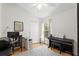 Home office with natural light, complete with a desk, chair, and keyboard piano at 10361 Lightner Bridge Dr, Tampa, FL 33626