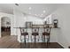 Kitchen featuring stainless steel appliances, granite countertops, bar seating, and white cabinets at 10361 Lightner Bridge Dr, Tampa, FL 33626