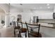 Kitchen bar with granite countertops, stainless steel appliances, and white cabinets at 10361 Lightner Bridge Dr, Tampa, FL 33626
