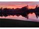 Backyard lake view at sunset at 10361 Lightner Bridge Dr, Tampa, FL 33626