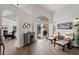Bright living room featuring vaulted ceilings and a view of the pool through sliding glass doors at 10361 Lightner Bridge Dr, Tampa, FL 33626