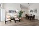 Bright living area with a dining table, lounge chairs, and elegant decor at 10361 Lightner Bridge Dr, Tampa, FL 33626