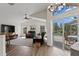 Modern living room with high ceilings, a view of the pool, and an open layout at 10361 Lightner Bridge Dr, Tampa, FL 33626