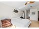 Bright main bedroom with neutral walls, a ceiling fan and hardwood flooring at 10361 Lightner Bridge Dr, Tampa, FL 33626