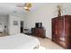 Bright main bedroom with neutral walls, a ceiling fan and hardwood flooring at 10361 Lightner Bridge Dr, Tampa, FL 33626