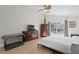 Bright main bedroom with neutral walls, a ceiling fan and hardwood flooring at 10361 Lightner Bridge Dr, Tampa, FL 33626
