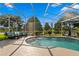 Inviting screened-in pool with lake views, offering a perfect blend of indoor and outdoor living at 10361 Lightner Bridge Dr, Tampa, FL 33626