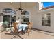 Covered patio with a ceiling fan overlooks the pool, offering cool outdoor relaxation at 10361 Lightner Bridge Dr, Tampa, FL 33626