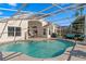 A beautiful swimming pool area with a screened enclosure and outdoor seating for relaxation at 10361 Lightner Bridge Dr, Tampa, FL 33626