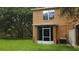 An enclosed patio offers a relaxing space in the home's backyard at 10819 Lake Saint Charles Blvd, Riverview, FL 33578
