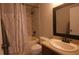 Full bathroom with a shower-tub combo, decorative curtain and neutral countertop at 10819 Lake Saint Charles Blvd, Riverview, FL 33578