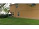 Exterior shot of the side yard with grass at 10819 Lake Saint Charles Blvd, Riverview, FL 33578