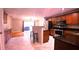 Well-appointed kitchen with stainless appliances, granite counters, and open floorplan at 10819 Lake Saint Charles Blvd, Riverview, FL 33578
