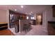 Open kitchen with stainless steel appliances, dark countertops, and stool seating at 10819 Lake Saint Charles Blvd, Riverview, FL 33578