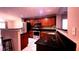 Modern kitchen with stainless steel appliances, granite countertops, and cherry wood cabinets at 10819 Lake Saint Charles Blvd, Riverview, FL 33578