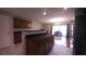 Kitchen with wood cabinets, granite counters, marble flooring and a view to the patio at 10819 Lake Saint Charles Blvd, Riverview, FL 33578