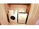 A laundry room with a washer and dryer near a closet at 10819 Lake Saint Charles Blvd, Riverview, FL 33578