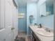 Bright bathroom features a shower and vanity with ample counter space and natural light at 11704 Orange Grove Ter, Riverview, FL 33569