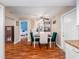 Dining room featuring laminate flooring, breakfast nook, and modern ceiling fan at 11704 Orange Grove Ter, Riverview, FL 33569