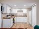 Bright kitchen with white cabinets, tile floors and modern appliances ready for your culinary expertise at 11704 Orange Grove Ter, Riverview, FL 33569