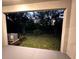A serene backyard with lush green grass offers a peaceful outdoor space at 11847 Dumaine Valley Rd, Riverview, FL 33579