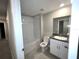 A clean, well-lit bathroom featuring a single vanity and a bathtub with a showerhead at 11847 Dumaine Valley Rd, Riverview, FL 33579