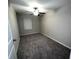 Cozy carpeted bedroom featuring a ceiling fan, neutral walls, and a window with blinds at 11847 Dumaine Valley Rd, Riverview, FL 33579