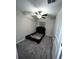 Empty bedroom featuring a dark headboard resting on neutral carpet with neutral-colored walls and a ceiling fan at 11847 Dumaine Valley Rd, Riverview, FL 33579