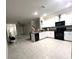 Bright, open kitchen boasting stainless steel appliances and ample counter space at 11847 Dumaine Valley Rd, Riverview, FL 33579