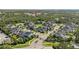 Aerial view of a lovely neighborhood, with mature landscaping and water features at 12121 Rustic River Way, Tampa, FL 33635