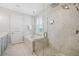 Modern bathroom featuring a glass shower, marble countertops, and sleek design at 12121 Rustic River Way, Tampa, FL 33635