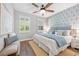 Bright and airy bedroom with a ceiling fan, hardwood floors and a blue color scheme at 12121 Rustic River Way, Tampa, FL 33635