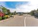 A lovely gated community entrance with stone pillars and lush landscaping at 12121 Rustic River Way, Tampa, FL 33635