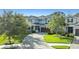 Charming two-story home with manicured landscaping, paver driveway and inviting curb appeal at 12121 Rustic River Way, Tampa, FL 33635