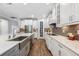 Modern kitchen showcasing a stainless steel sink, subway tile backsplash, and plenty of counter space at 12121 Rustic River Way, Tampa, FL 33635