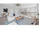 Spacious upstairs loft area with neutral carpet, a comfy sofa, and stairs with dark wood railings at 12121 Rustic River Way, Tampa, FL 33635