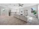 Upstairs loft featuring neutral colors, carpet floors, a ceiling fan, and lots of natural light at 12121 Rustic River Way, Tampa, FL 33635