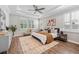 Main bedroom suite showcasing hardwood floors, lots of light, and neutral paint colors at 12121 Rustic River Way, Tampa, FL 33635