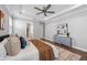 Spacious main bedroom featuring a ceiling fan, tray ceiling and stylish, modern decor at 12121 Rustic River Way, Tampa, FL 33635