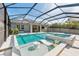 Resort style screened-in pool and spa with sun shelf, in-pool seating, and plenty of space for lounging at 12121 Rustic River Way, Tampa, FL 33635