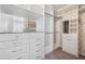 Walk-in closet with custom shelves, drawers, carpet floors and a mirror at 12121 Rustic River Way, Tampa, FL 33635