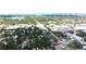 An elevated view showcases this charming neighborhood with lush green trees and convenient access to nearby amenities and roads at 1317 S Betty Ln, Clearwater, FL 33756