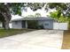Charming single-story home featuring a spacious driveway and well-maintained landscaping at 1317 S Betty Ln, Clearwater, FL 33756