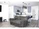 Open-concept kitchen and living area with stainless steel appliances and modern finishes at 1317 S Betty Ln, Clearwater, FL 33756