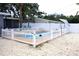 A fenced in backyard featuring a private swimming pool with wood deck at 1317 S Betty Ln, Clearwater, FL 33756