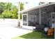 A screened-in porch offers access to the backyard, pool, and patio area at 1317 S Betty Ln, Clearwater, FL 33756