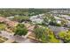 Aerial view of a property showcasing its beautiful neighborhood with tree lined streets and landscaping at 1363 Cottage Grove Rd, Tarpon Springs, FL 34689