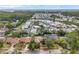 Community near water featuring mature trees and landscaping, creating a relaxed and inviting atmosphere at 1363 Cottage Grove Rd, Tarpon Springs, FL 34689