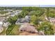 Charming home featuring mature trees and a spacious backyard, perfect for outdoor living and entertaining at 1363 Cottage Grove Rd, Tarpon Springs, FL 34689