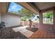 The front entrance features pillars with potted plants, and a sitting area with outdoor decorations at 1363 Cottage Grove Rd, Tarpon Springs, FL 34689